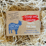 Cyril's Soap Shed goat's milk soap packaging on a bed of straw
