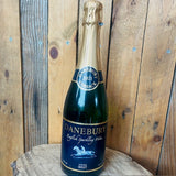 Bottle of Danebury English Sparkling Wine on a wooden surface