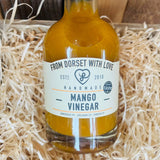 Bottle of From Dorset With Love Mango Vinegar – artisan Dorset fruit vinegar with mango pulp.