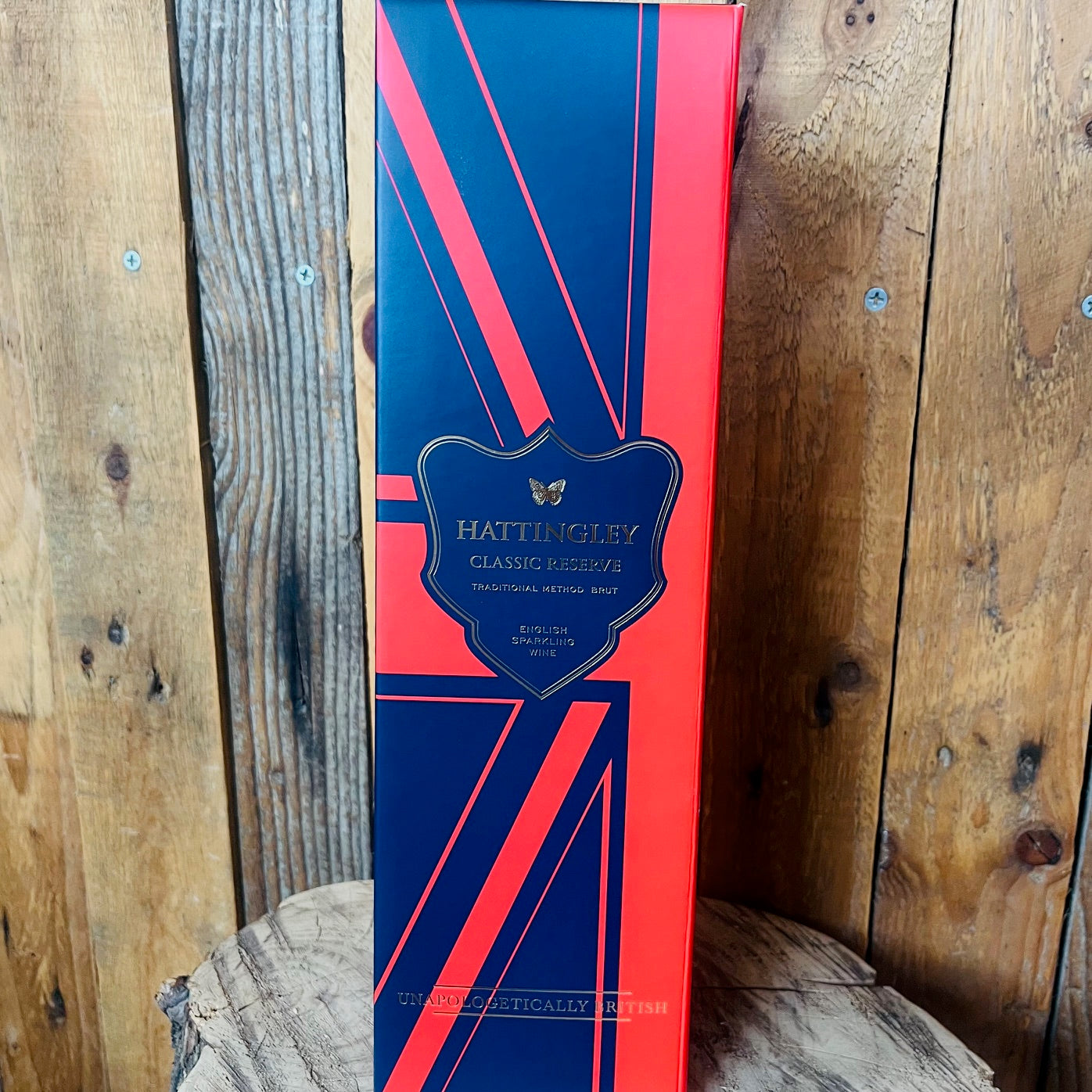 Blue and red box with 'Hattingley' branding on a wooden surface
