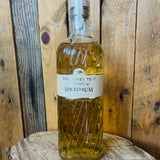 Bottle of spiced rum from The River Test Distillery on a wooden background