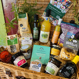 New Forest Shortbread, Brockenhurst Breakfast tea, Forest Edge ground coffee and a Beaulieu Chocolate Studio honeycomb bar in The Local Pantry Hamper's 20 inch lidded willow basket