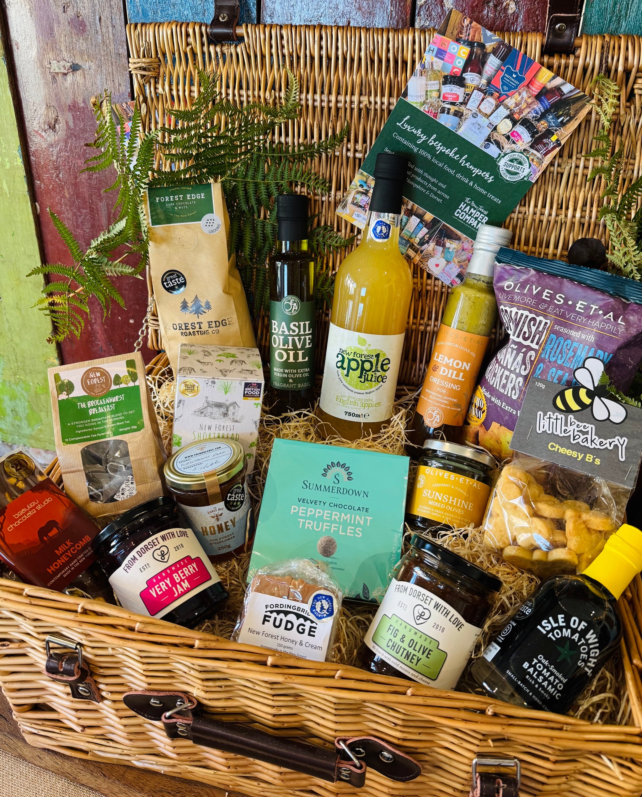 New Forest Shortbread, Brockenhurst Breakfast tea, Forest Edge ground coffee and a Beaulieu Chocolate Studio honeycomb bar in The Local Pantry Hamper's 20 inch lidded willow basket