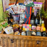 The Ultimate Hampshire & Dorset Hamper - a 24 inch lidded willow basket filled with Hattingley Valley sparkling wine, B58 and Danebury wines, 820 Spirits gin, Downton ales, Real Cure charcuterie, Chococo chocolates and local preserves, dressed with fern