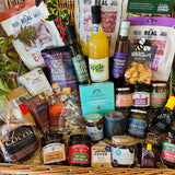 The Ultimate Christmas Goodies Hamper from above - thirty festive items including Beaulieu chocolate Christmas trees, Summerdown peppermint truffles, Christmas pudding festive nuts and New Forest Shortbread in a 24 inch willow basket