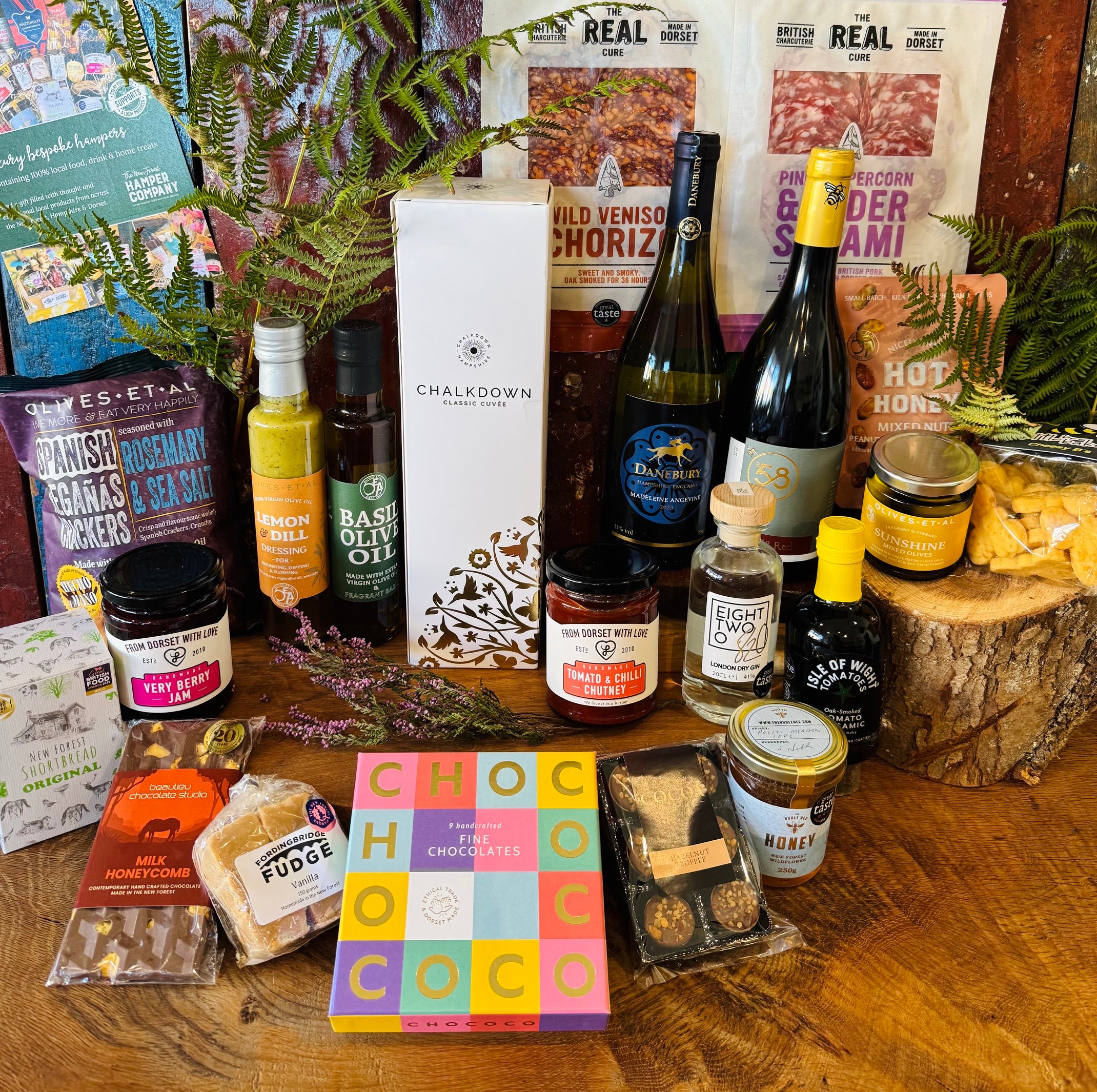 The Real Cure Dorset charcuterie with Spanish Reganas crackers, Olives et Al olives and Little Bee Bakery Cheesy B's in a New Forest celebration hamper