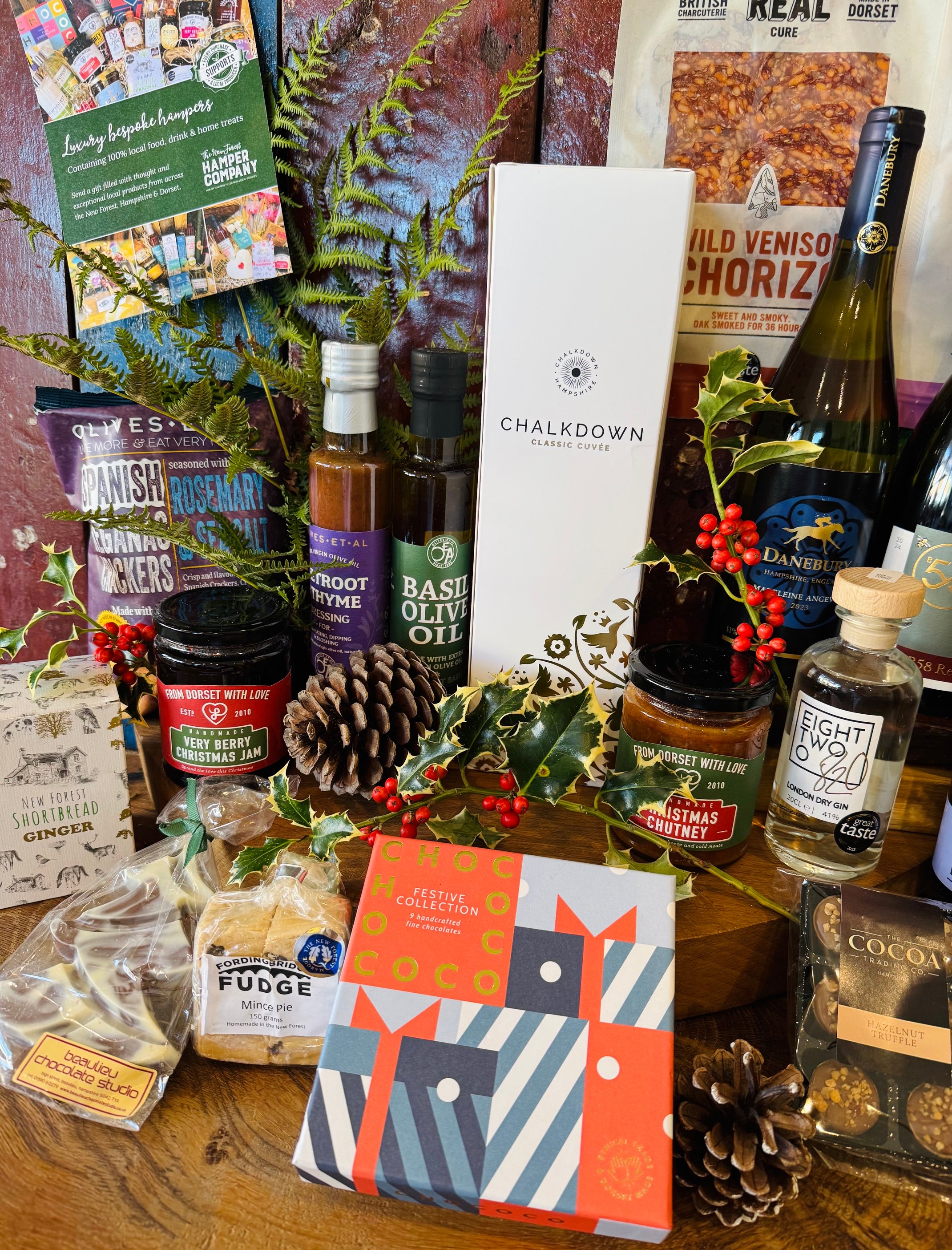 Festive hamper contents including Chococo chocolates, Beaulieu chocolate Christmas tree, mince pie fudge and ginger shortbread
