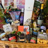 Chalkdown sparkling, Danebury and B58 wines and 820 Spirits gin packed into a 20 inch lidded willow Christmas hamper
