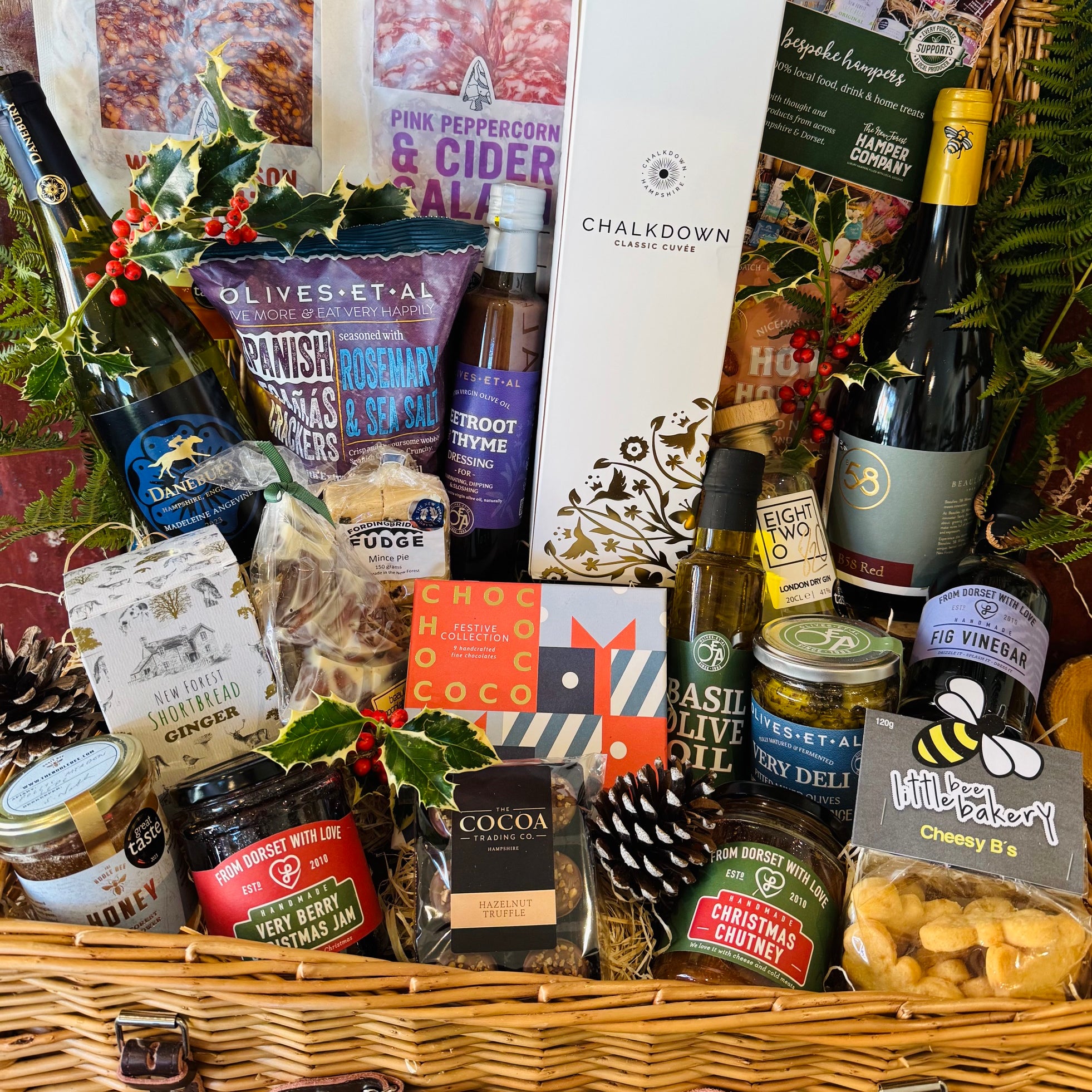 Chalkdown sparkling, Danebury and B58 wines and 820 Spirits gin packed into a 20 inch lidded willow Christmas hamper