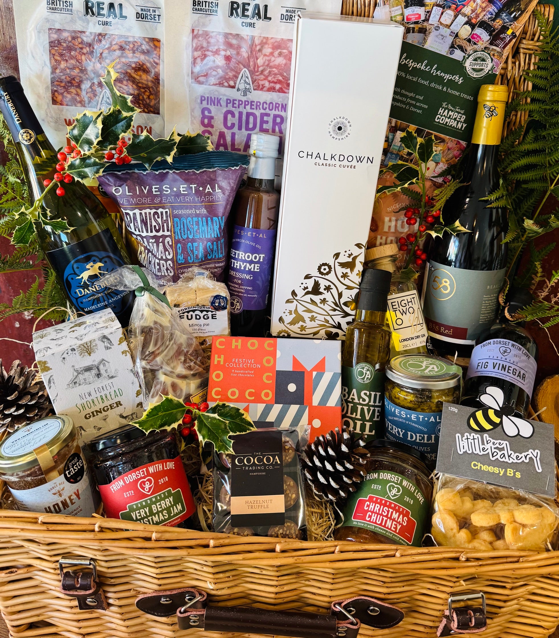 Chalkdown sparkling, Danebury and B58 wines and 820 Spirits gin packed into a 20 inch lidded willow Christmas hamper