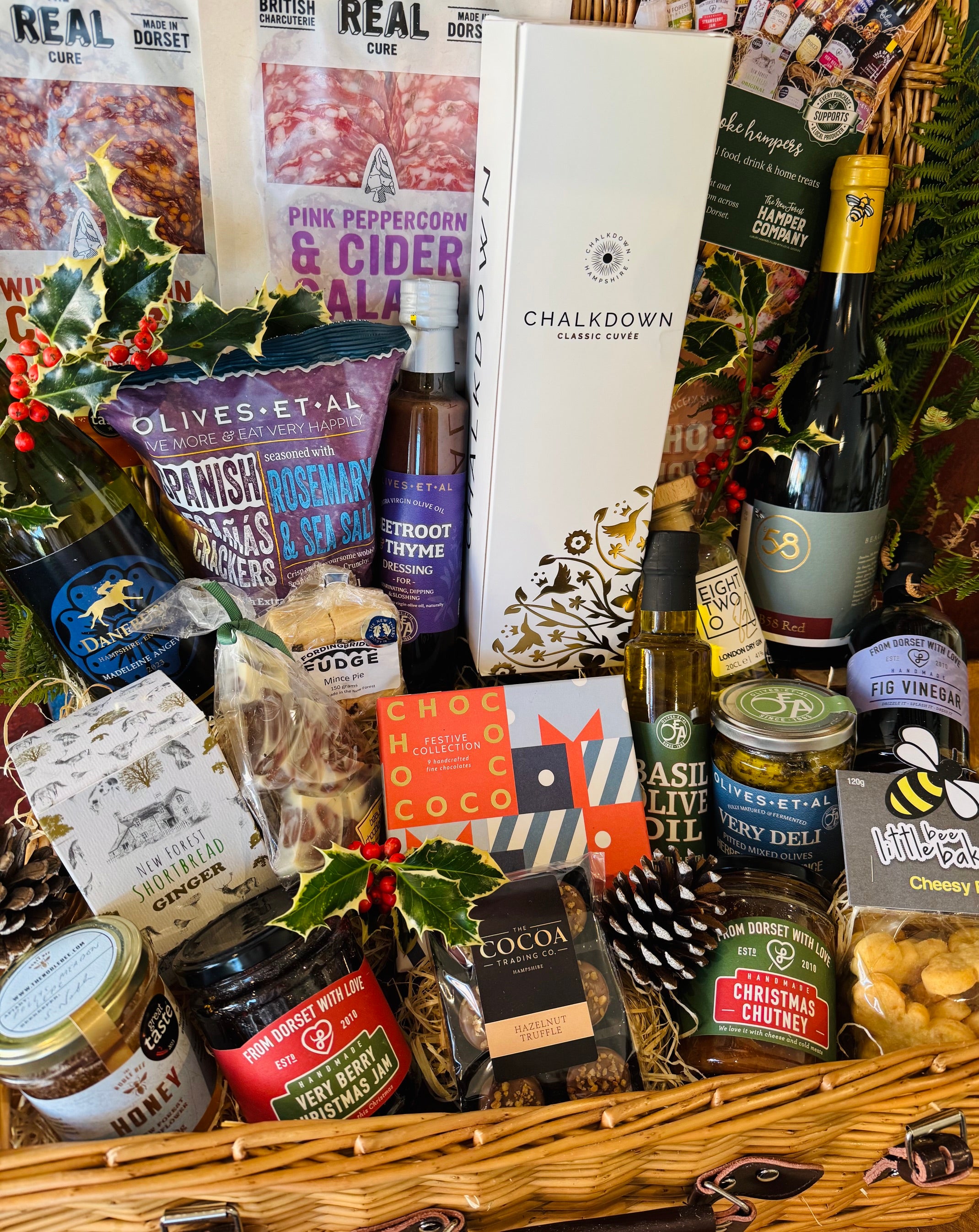 20 inch double steamed lidded willow hamper with leather straps, filled with local Christmas food and drink