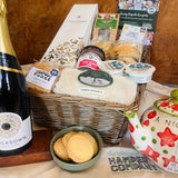 Chalkdown Afternoon Tea Hamper in an extra large antique willow basket with Chalkdown Classic Cuvée English sparkling wine, fruit scones, Rodda's clotted cream, lemon drizzle cake, New Forest Shortbread, Very Berry jam, clotted cream fudge and Brockenhurst Breakfast tea