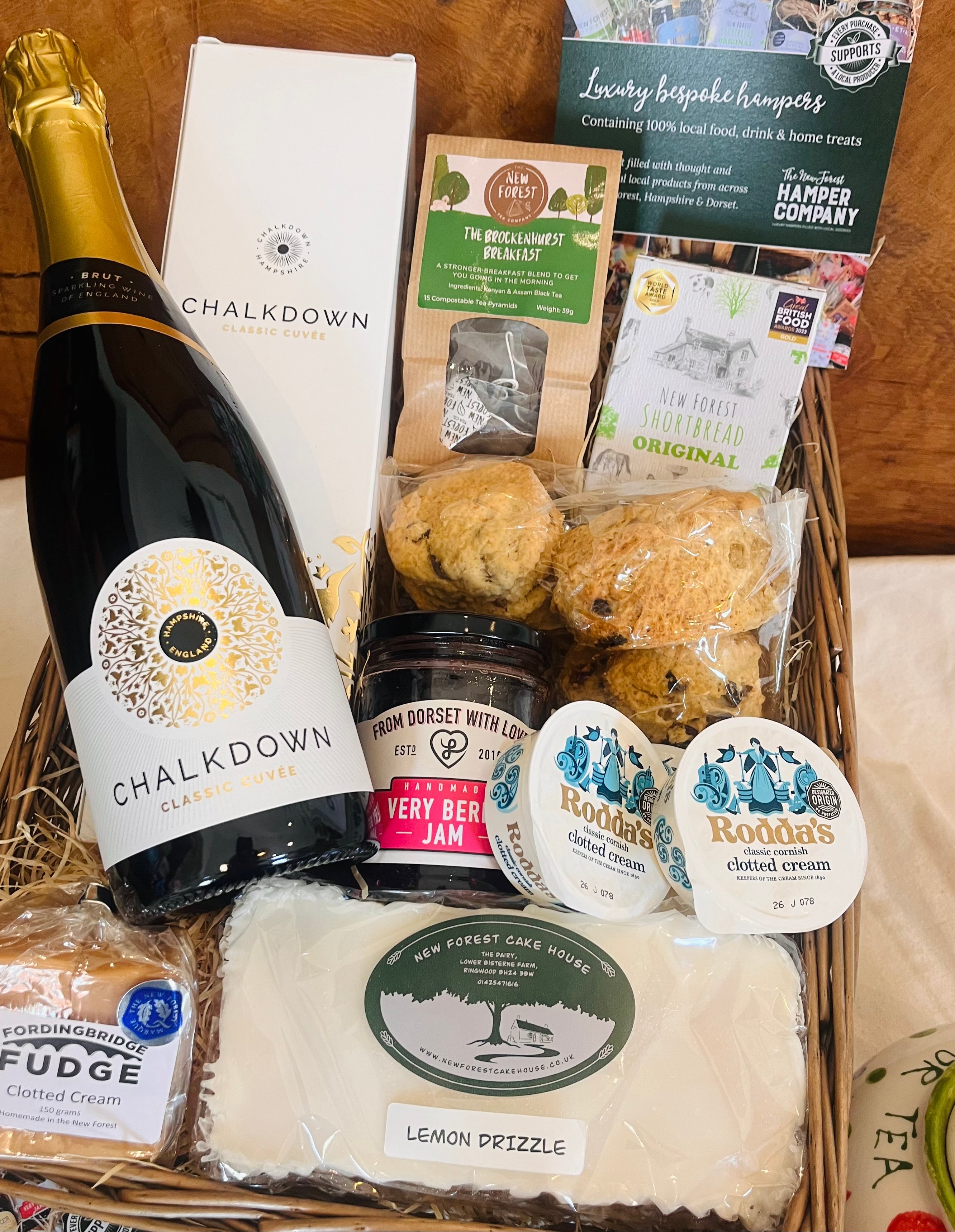 Chalkdown Afternoon Tea Hamper basket dressed and ready to give, with Chalkdown Classic Cuvée and a full New Forest cream tea
