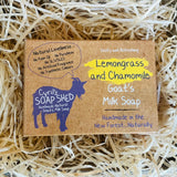 Goat's milk soap packaging with lemongrass and chamomile scent on a bed of straw.