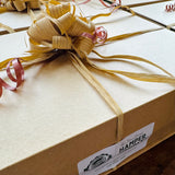Giftbox with wood wool and dressings, used to present New Forest Hamper Company ready-to-go gifts