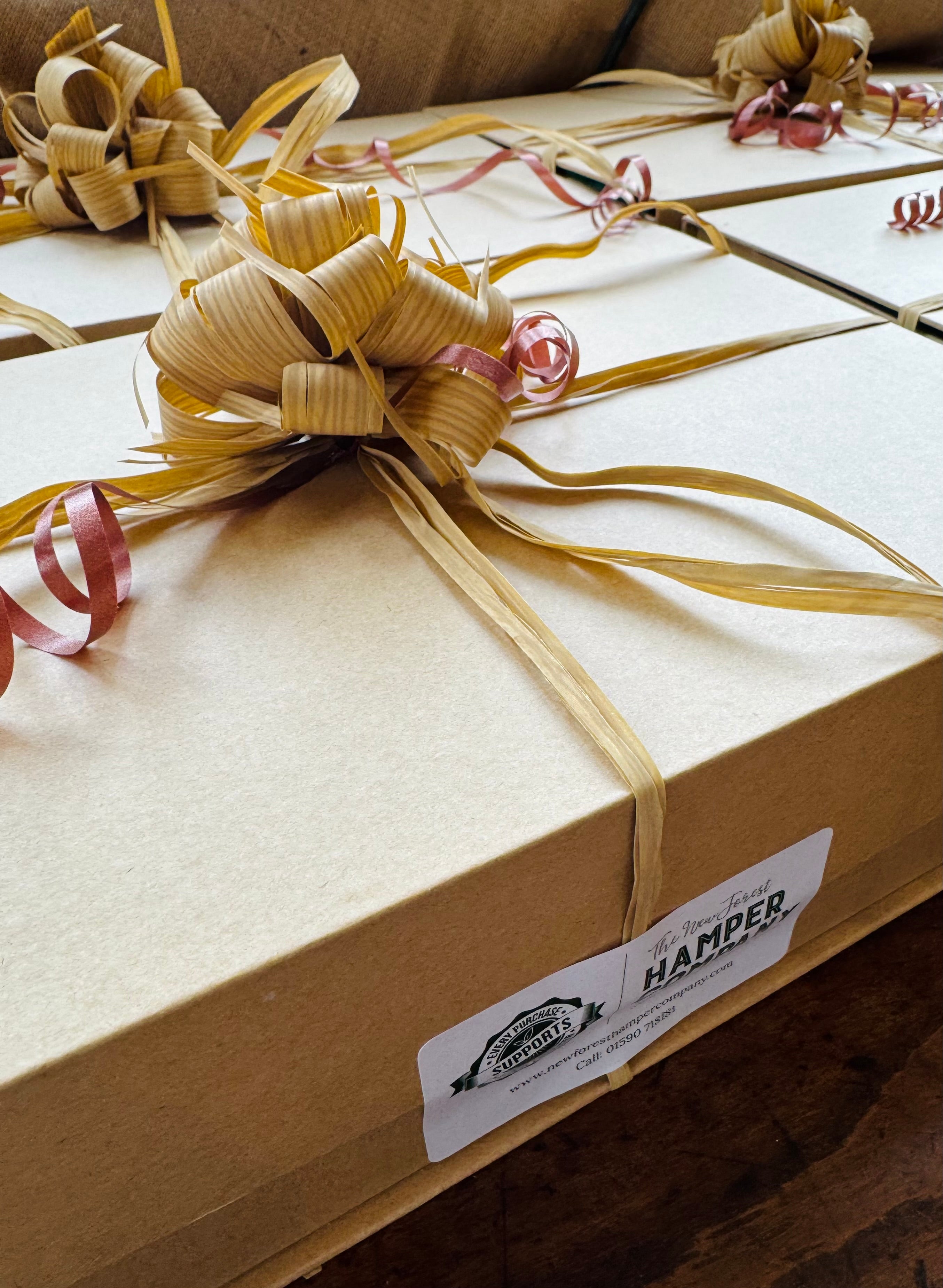 Giftbox with wood wool and dressings, used to present New Forest Hamper Company ready-to-go gifts