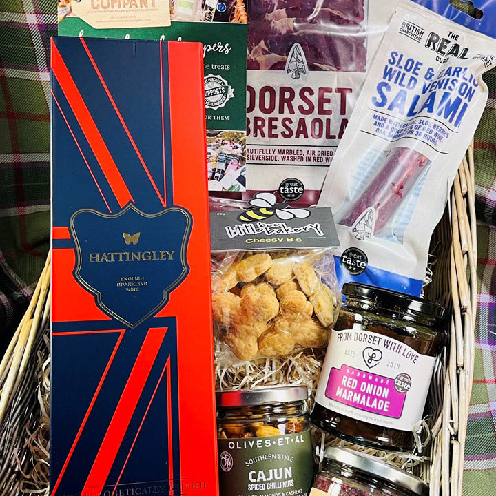 Gift basket with various items including a box labeled 'Hattingley' and food products.