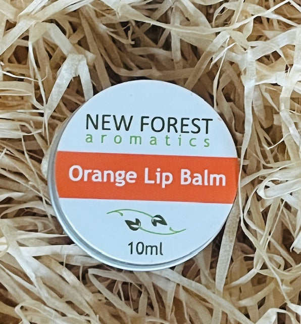 New Forest Aromatics Orange Lip Balm on a bed of straw