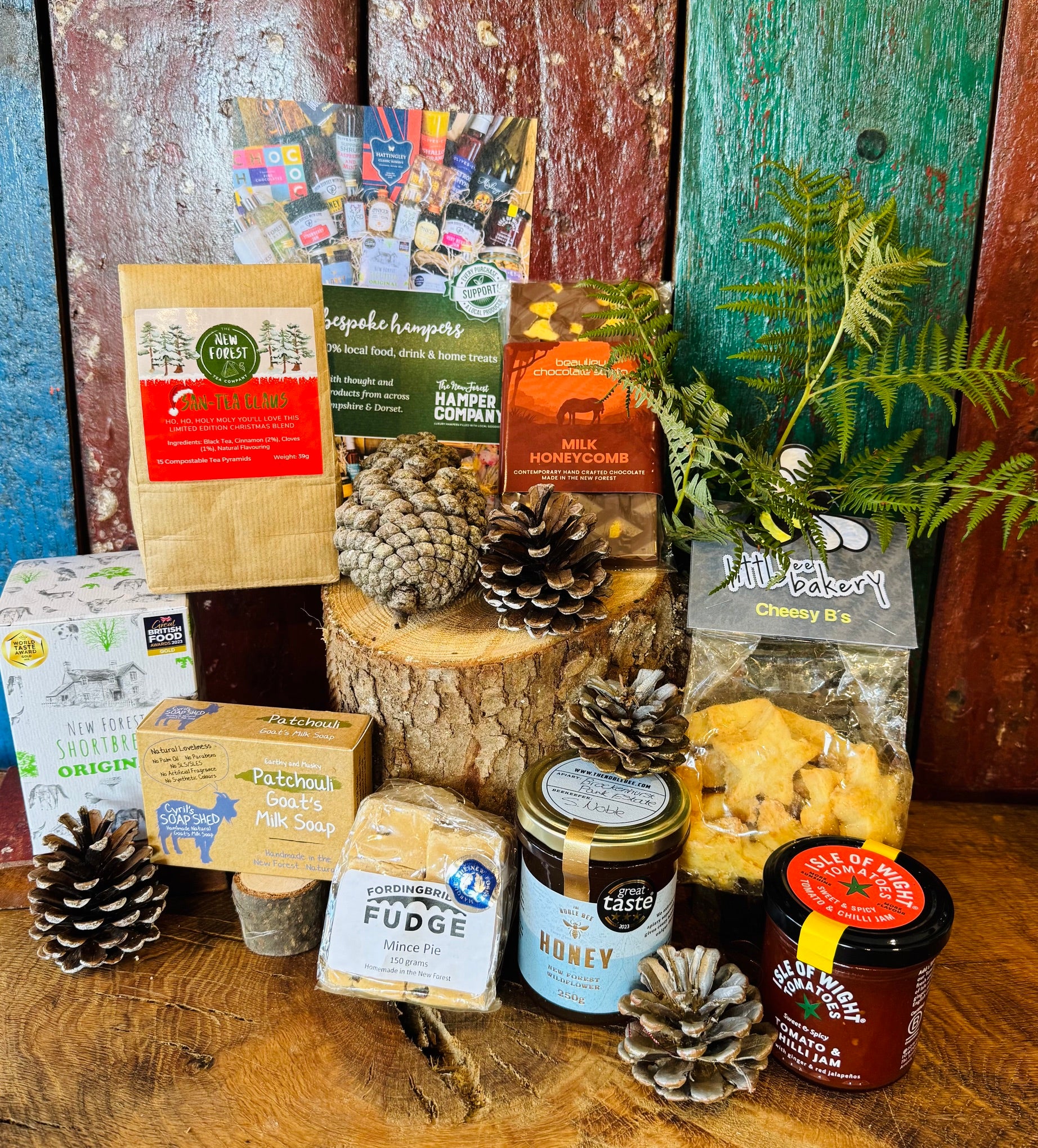 Festive Hampshire Giftbox contents displayed with San-Tea Claus limited edition Christmas tea, Great Taste three star honey and Fordingbridge mince pie fudge