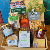 Hampshire Giftbox contents displayed with Noble Bee honey, New Forest Tea Company Brockenhurst Breakfast, gold award-winning New Forest Shortbread and Cyril's Soap Shed goat's milk soap