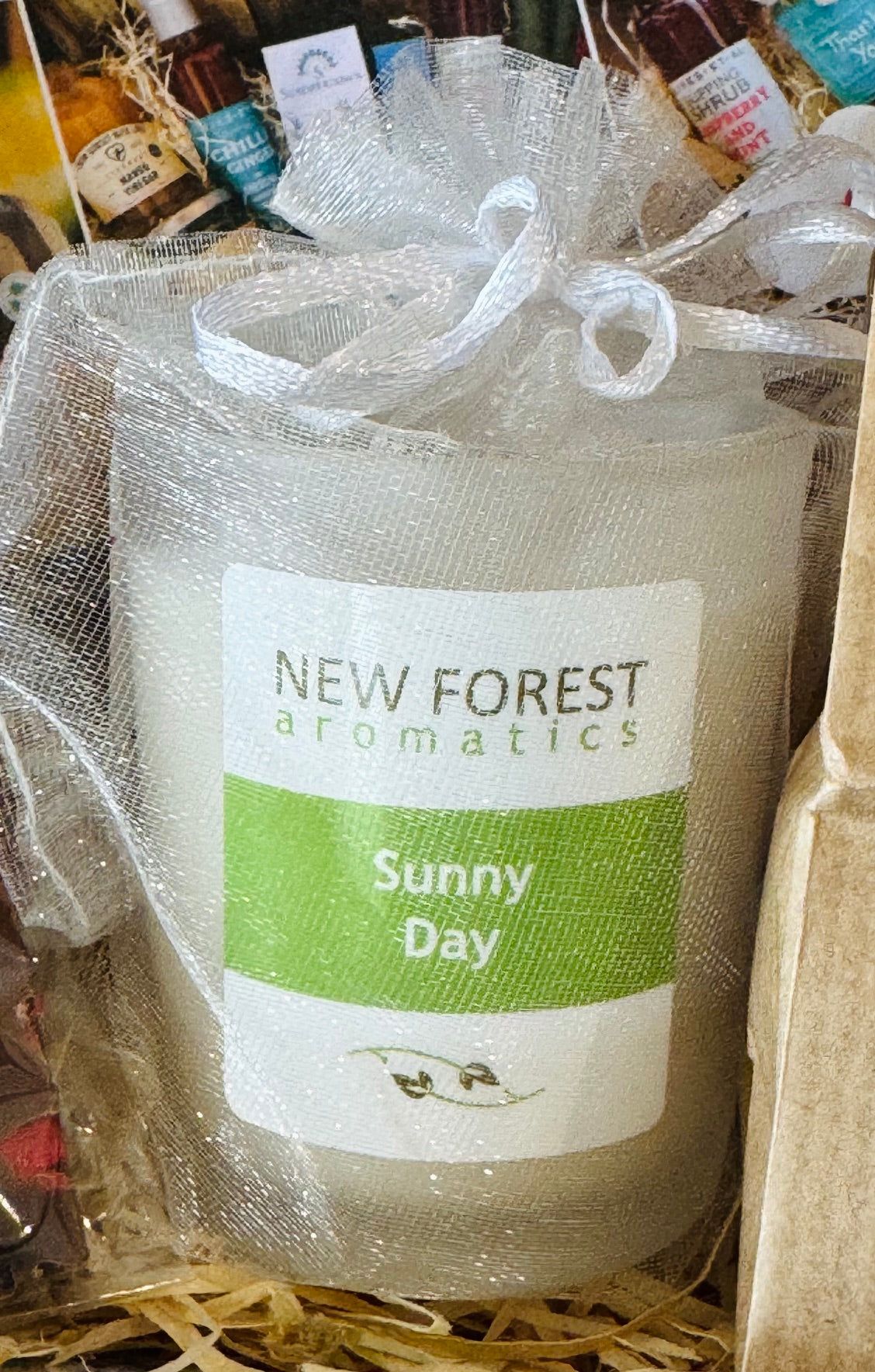 New Forest Aromatics Sunny Day candle in an organza bag
