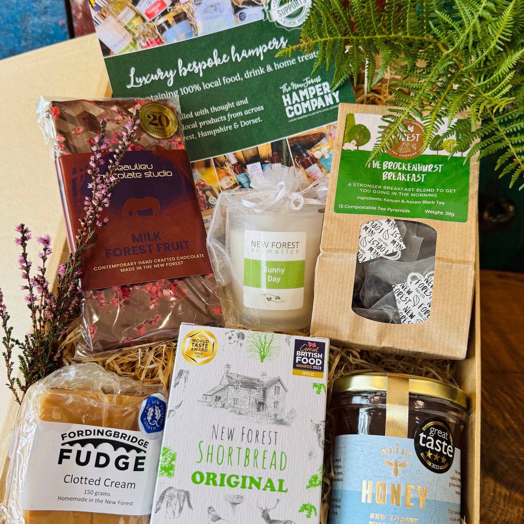 New Forest Marque Giftbox filled with Beaulieu chocolate, New Forest Shortbread, wildflower honey, Brockenhurst tea, clotted cream fudge and a Sunny Day candle