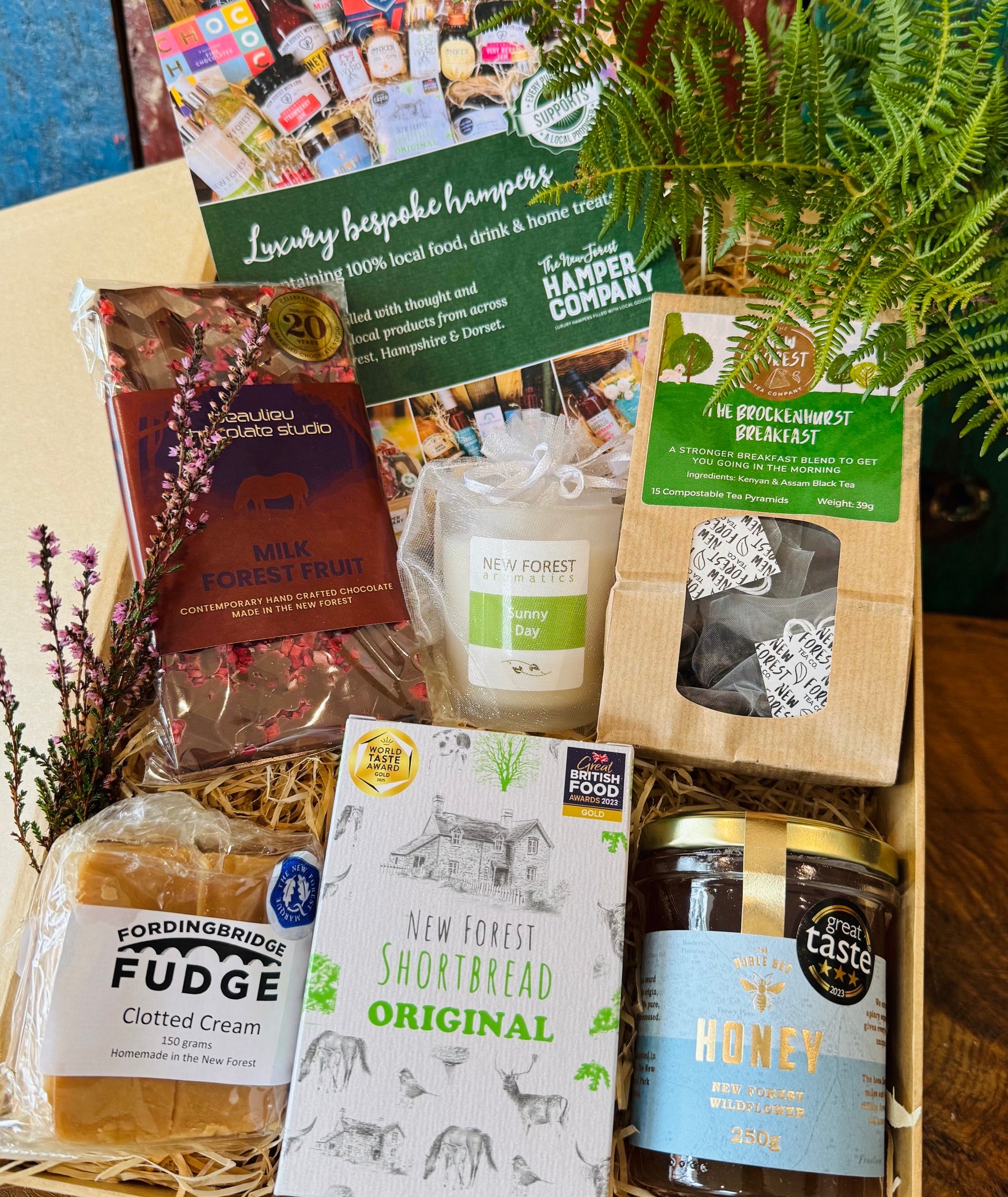 New Forest Marque Giftbox filled with Beaulieu chocolate, New Forest Shortbread, wildflower honey, Brockenhurst tea, clotted cream fudge and a Sunny Day candle