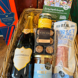 Hattingley Gourmet Grazer basket filled with Hattingley Classic Reserve, Real Cure Blue Vinny & Fig salami, Olives et Al Sunshine olives and Cocoa Trading hazelnut truffles
