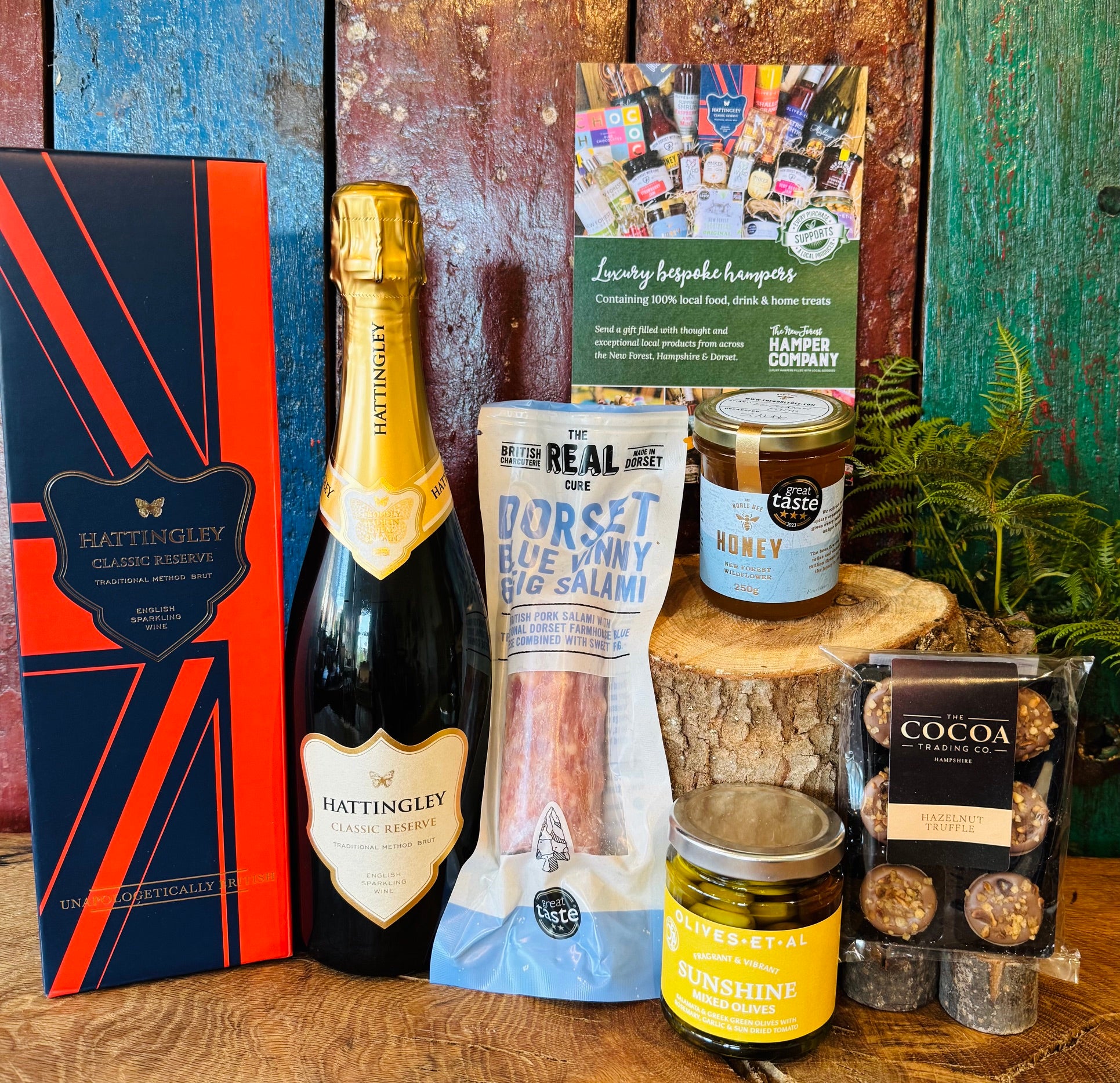Hattingley Gourmet Grazer contents laid out with the Classic Reserve gift box, Dorset salami, Greek mixed olives, Great Taste three star honey and hazelnut truffle cups