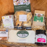 New Forest Hamper company Afternoon Tea Hamper with fruit scones, clotted cream, lemon drizzle cake, shortbread, fudge, jam and breakfast tea in wicker basket