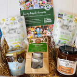 The Brockenhurst Tea & Treats Postal Box with Brockenhurst Breakfast tea, Noble Bee New Forest wildflower honey, From Dorset With Love Three Fruit marmalade and New Forest Shortbread in original and lemon