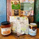Brockenhurst Tea & Treats Postal Box packed in the white postal box with award-winning New Forest Shortbread, New Forest wildflower honey, Brockenhurst Breakfast tea and Dorset three fruit marmalade