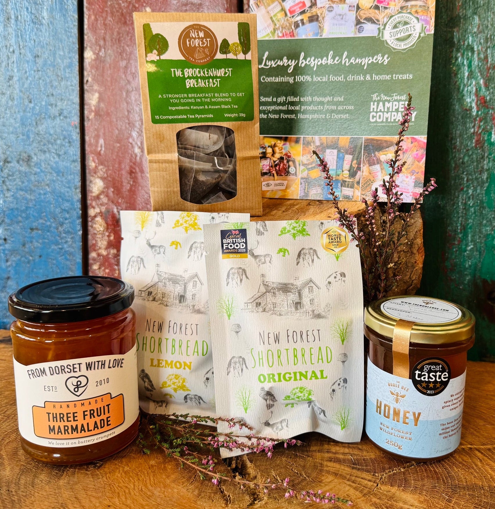 Brockenhurst Tea & Treats Postal Box packed in the white postal box with award-winning New Forest Shortbread, New Forest wildflower honey, Brockenhurst Breakfast tea and Dorset three fruit marmalade