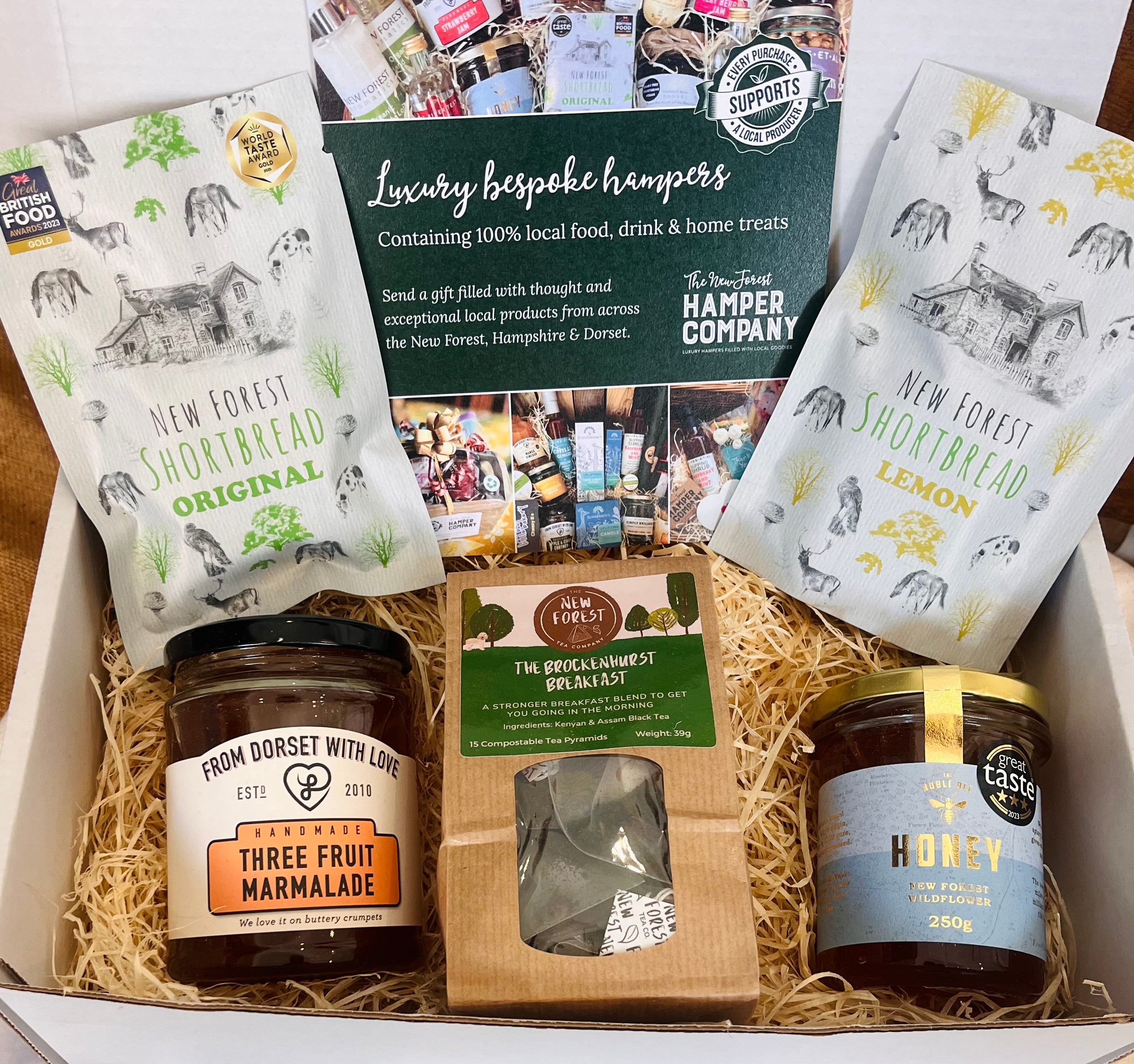 The Brockenhurst Tea & Treats Postal Box with Brockenhurst Breakfast tea, Noble Bee New Forest wildflower honey, Three Fruit marmalade and two bags of New Forest Shortbread