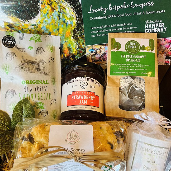 Collection of New Forest food products including jam, shortbread, and scones with branded packaging.