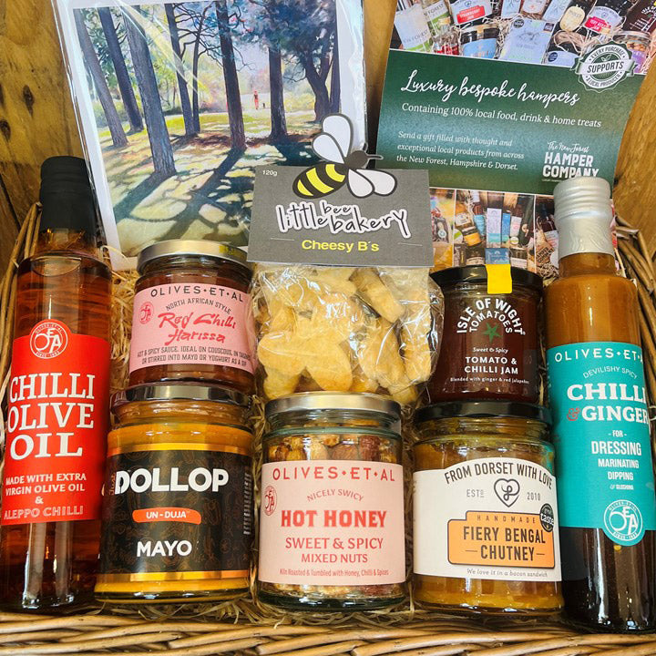 Assorted food items including jars, bottles, and a card in a basket